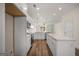 Well-lit kitchen with stainless steel appliances, quartz countertops, and center island at 105 Creekside Knl, Grantville, GA 30220