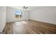 Bright living room with light-filled window and wood-look flooring at 105 Creekside Knl, Grantville, GA 30220