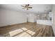 Spacious living area showcasing an open layout with wood-look floors and modern lighting at 105 Creekside Knl, Grantville, GA 30220