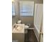 Bathroom featuring a single sink vanity, a toilet, and a bathtub with shower head at 4572 Sahara Sw Dr, Atlanta, GA 30331