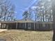 Inviting single-story home with a brick facade, covered carport and well-maintained lawn at 4572 Sahara Sw Dr, Atlanta, GA 30331