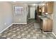 Functional kitchen area featuring a tiled floor, stainless steel appliances and wood cabinetry at 4572 Sahara Sw Dr, Atlanta, GA 30331