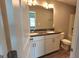 Bathroom featuring a double vanity with granite countertops and a shower-tub combo at 2780 Laurel Ridge Cir, East Point, GA 30344