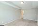 A peaceful bedroom with neutral colors, a tray ceiling, and soft carpet flooring at 2780 Laurel Ridge Cir, East Point, GA 30344