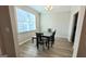 Bright dining room with a modern table set and a large window for natural light at 2780 Laurel Ridge Cir, East Point, GA 30344