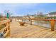 A cozy wooden back deck with lake views featuring a fire pit and comfortable outdoor seating area at 306 Turtle Pointe Dr, Carrollton, GA 30116