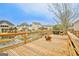 A spacious wooden back deck with lake views, grill, and fire pit, perfect for outdoor entertaining at 306 Turtle Pointe Dr, Carrollton, GA 30116