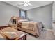 Comfortable bedroom with a wooden bed frame, soft lighting, and a decorative nightstand at 306 Turtle Pointe Dr, Carrollton, GA 30116