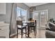 Cozy dining area with a view of the backyard through large windows, adjacent to the kitchen at 306 Turtle Pointe Dr, Carrollton, GA 30116