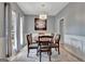 Bright dining room featuring a chandelier, light gray walls, and a large rug at 306 Turtle Pointe Dr, Carrollton, GA 30116