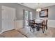 Bright dining room featuring a chandelier, light gray walls, and a large rug at 306 Turtle Pointe Dr # 32, Carrollton, GA 30116