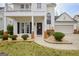 Inviting front porch with brick columns and a decorative front door at 306 Turtle Pointe Dr, Carrollton, GA 30116