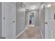 Spacious upstairs hallway connects bedrooms and bathrooms at 306 Turtle Pointe Dr, Carrollton, GA 30116