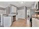 Bright kitchen with stainless steel appliances, white cabinets, and convenient access to laundry at 306 Turtle Pointe Dr, Carrollton, GA 30116