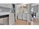 Convenient laundry room featuring a washer and dryer, accessible from the kitchen and dining area at 306 Turtle Pointe Dr, Carrollton, GA 30116