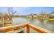 A tranquil lake view from a wood deck, showcasing serene surroundings and natural beauty at 306 Turtle Pointe Dr, Carrollton, GA 30116