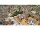 Aerial view of a beautiful, well-maintained brick home surrounded by mature trees in a desirable neighborhood at 10119 Azalea Dr, Covington, GA 30014