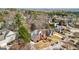 Aerial view of a beautiful, well-maintained brick home surrounded by mature trees in a desirable neighborhood at 10119 Azalea Dr, Covington, GA 30014