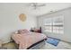 Bedroom featuring a bed, bright lighting, and blue rug at 10119 Azalea Dr, Covington, GA 30014