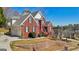 Stunning two-story brick home with an attached garage and beautifully landscaped yard at 10119 Azalea Dr, Covington, GA 30014