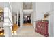 Spacious foyer with high ceilings, decorative columns, and stylish tile flooring at 10119 Azalea Dr, Covington, GA 30014