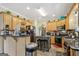 Well-lit kitchen featuring wooden cabinets, granite countertops and modern appliances at 10119 Azalea Dr, Covington, GA 30014