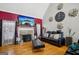 Cozy living room with a fireplace, a large TV, and comfortable seating at 10119 Azalea Dr, Covington, GA 30014