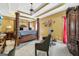 Spacious main bedroom showcasing tray ceiling and dark wood furniture at 10119 Azalea Dr, Covington, GA 30014