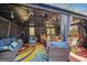 Covered outdoor living space featuring comfortable seating and dining area, perfect for entertaining at 10119 Azalea Dr, Covington, GA 30014
