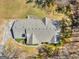 Overhead view showcasing the home's roof, chimney, expansive yard, and mature trees at 290 Rocky Branch Dr, Mcdonough, GA 30252