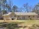Large backyard and exterior view with manicured lawn, perfect for outdoor activities at 290 Rocky Branch Dr, Mcdonough, GA 30252