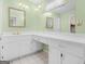 Bathroom with double sink, cabinets, and a large mirror at 290 Rocky Branch Dr, Mcdonough, GA 30252