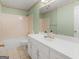 Bathroom with vanity, large mirror, white cabinets, and tiled bathtub at 290 Rocky Branch Dr, Mcdonough, GA 30252