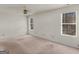 Spacious bedroom with natural light provided by two windows and ceiling fan at 290 Rocky Branch Dr, Mcdonough, GA 30252