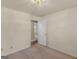 Bedroom with neutral walls, plush carpeting, and view through doorway at 290 Rocky Branch Dr, Mcdonough, GA 30252