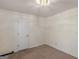 Bedroom featuring neutral walls, plush carpeting, and a convenient closet at 290 Rocky Branch Dr, Mcdonough, GA 30252