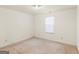 Light-filled bedroom with a window and neutral carpeting at 290 Rocky Branch Dr, Mcdonough, GA 30252