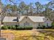 Charming one-story home with a well-maintained lawn and mature trees providing shade at 290 Rocky Branch Dr, Mcdonough, GA 30252
