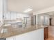 Spacious kitchen featuring granite countertops, white cabinetry, and an open design at 290 Rocky Branch Dr, Mcdonough, GA 30252