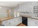 Open kitchen with white cabinets, granite countertops, and stainless steel appliances at 290 Rocky Branch Dr, Mcdonough, GA 30252