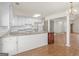 Spacious kitchen featuring granite countertops, white cabinetry, and access to the living space at 290 Rocky Branch Dr, Mcdonough, GA 30252