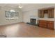 Cozy living area with fireplace, window, and custom built-ins at 290 Rocky Branch Dr, Mcdonough, GA 30252