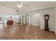 Open-concept living area with hardwood floors, and a kitchen island at 290 Rocky Branch Dr, Mcdonough, GA 30252