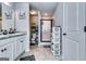 Bright bathroom offers dual vanities, framed mirror, and a modern glass enclosed shower at 1709 Creel Ln, South Fulton, GA 30349