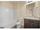 Bright bathroom featuring a shower-tub, toilet, and vanity with granite countertop at 2389 Aukerman Trce # 79, Hampton, GA 30228