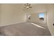 Expansive bedroom with carpet floors, two windows and a ceiling fan at 2389 Aukerman Trce # 79, Hampton, GA 30228