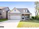 Charming single-Gathering home featuring a two-car garage, well-maintained lawn, and inviting curb appeal at 2389 Aukerman Trce # 79, Hampton, GA 30228
