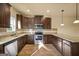 Bright kitchen with stainless steel appliances, granite countertops, and abundant cabinet storage at 2389 Aukerman Trce # 79, Hampton, GA 30228