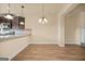Well-lit kitchen with stainless steel appliances, granite countertops, and pendant lighting above the breakfast bar at 2389 Aukerman Trce # 79, Hampton, GA 30228