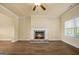 Inviting living room with a fireplace, hardwood floors, and large windows providing natural light at 2389 Aukerman Trce # 79, Hampton, GA 30228